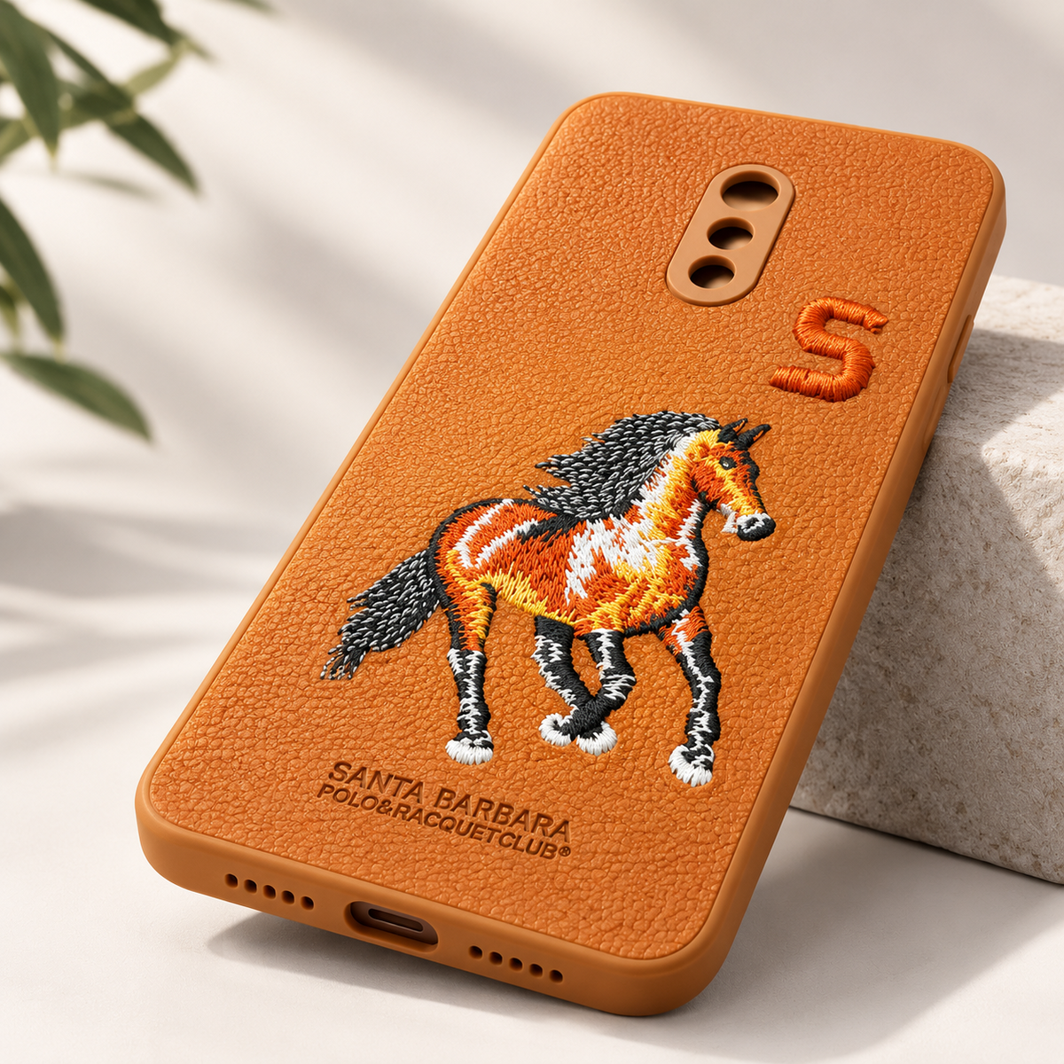 Angled view of BrownOnePlus 7 textured embroidered horse back cover