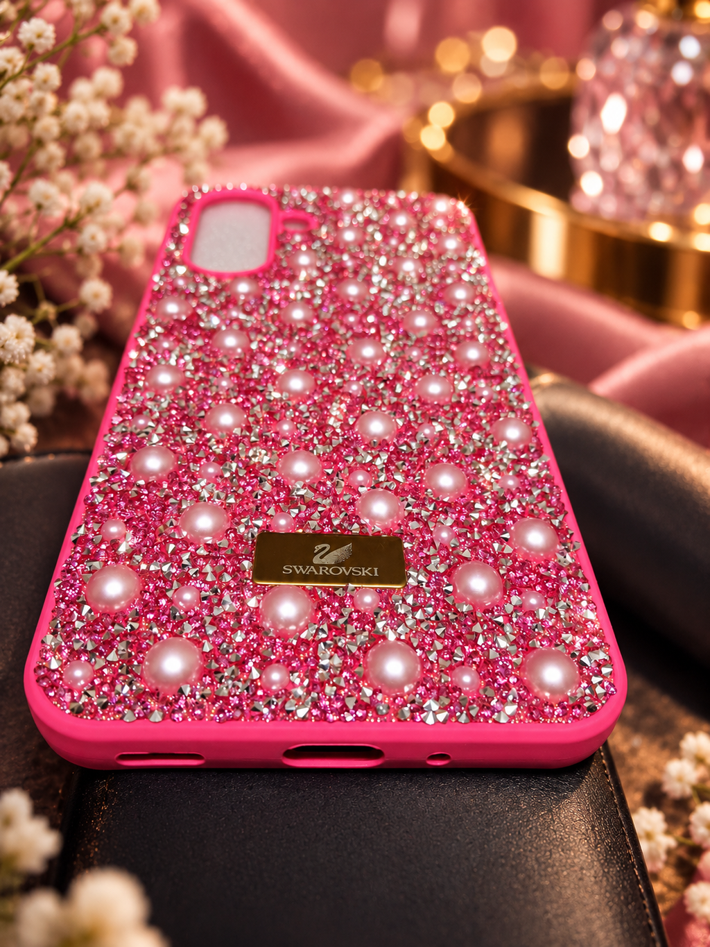 Pink rhinestone and pearl Samsung Galaxy A17/A26 case in a luxury-style product scene