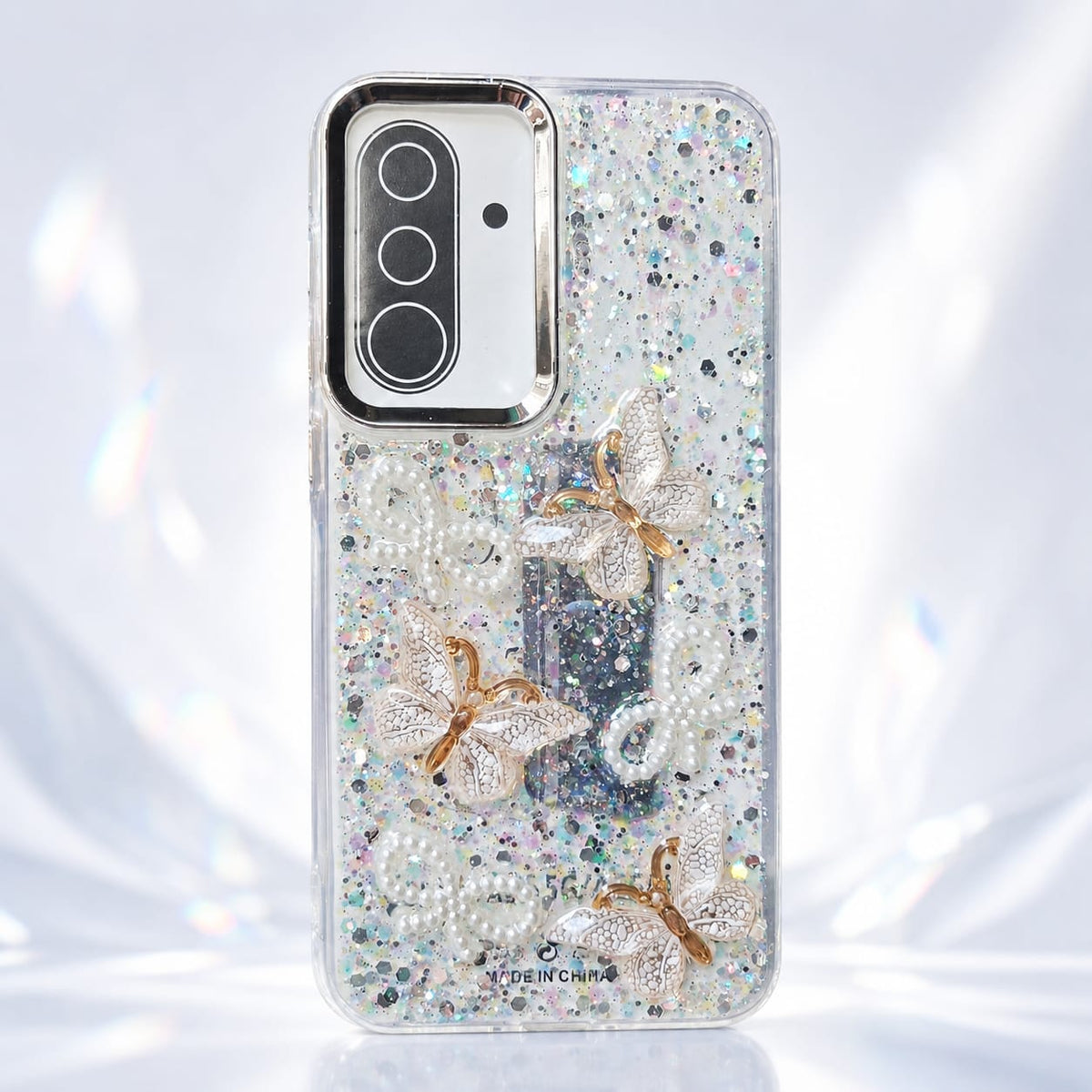 White glitter butterfly phone case with pearl-style details and raised decorative accents