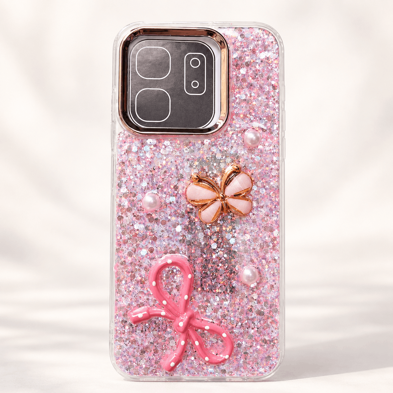 Pink glitter phone case with 3D butterfly, bow and pearl-style details