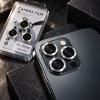 Silver camera lens protector rings shown installed on an iPhone 12 Pro Max style triple camera module