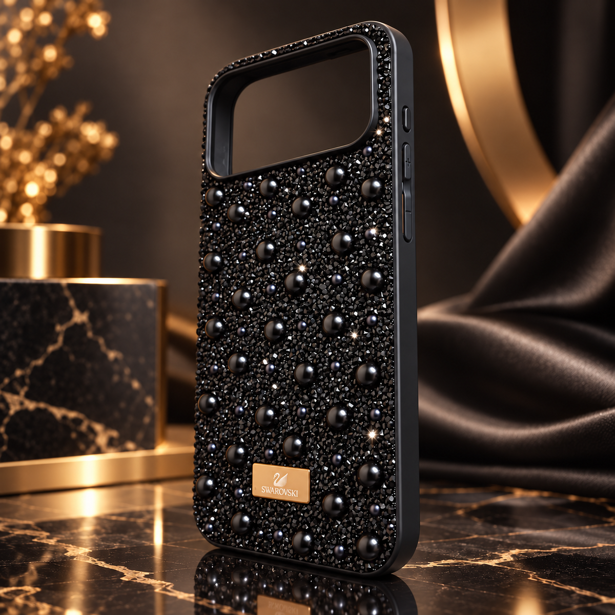 Black rhinestone and pearl fashion case for iPhone 17 Pro Max in a black and gold premium studio setting