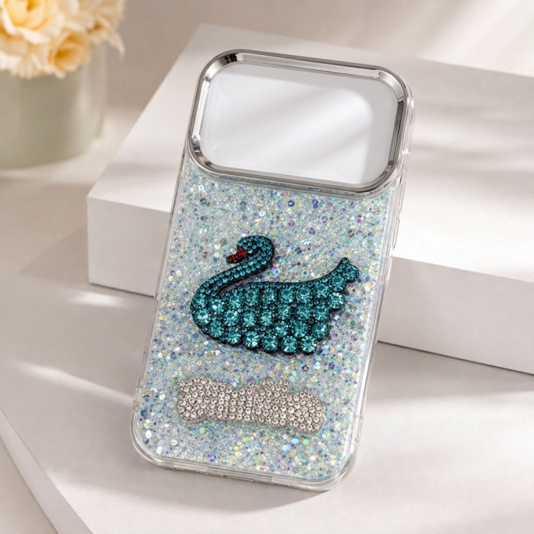 iPhone 17 Pro clear glitter case with teal rhinestone-style swan design