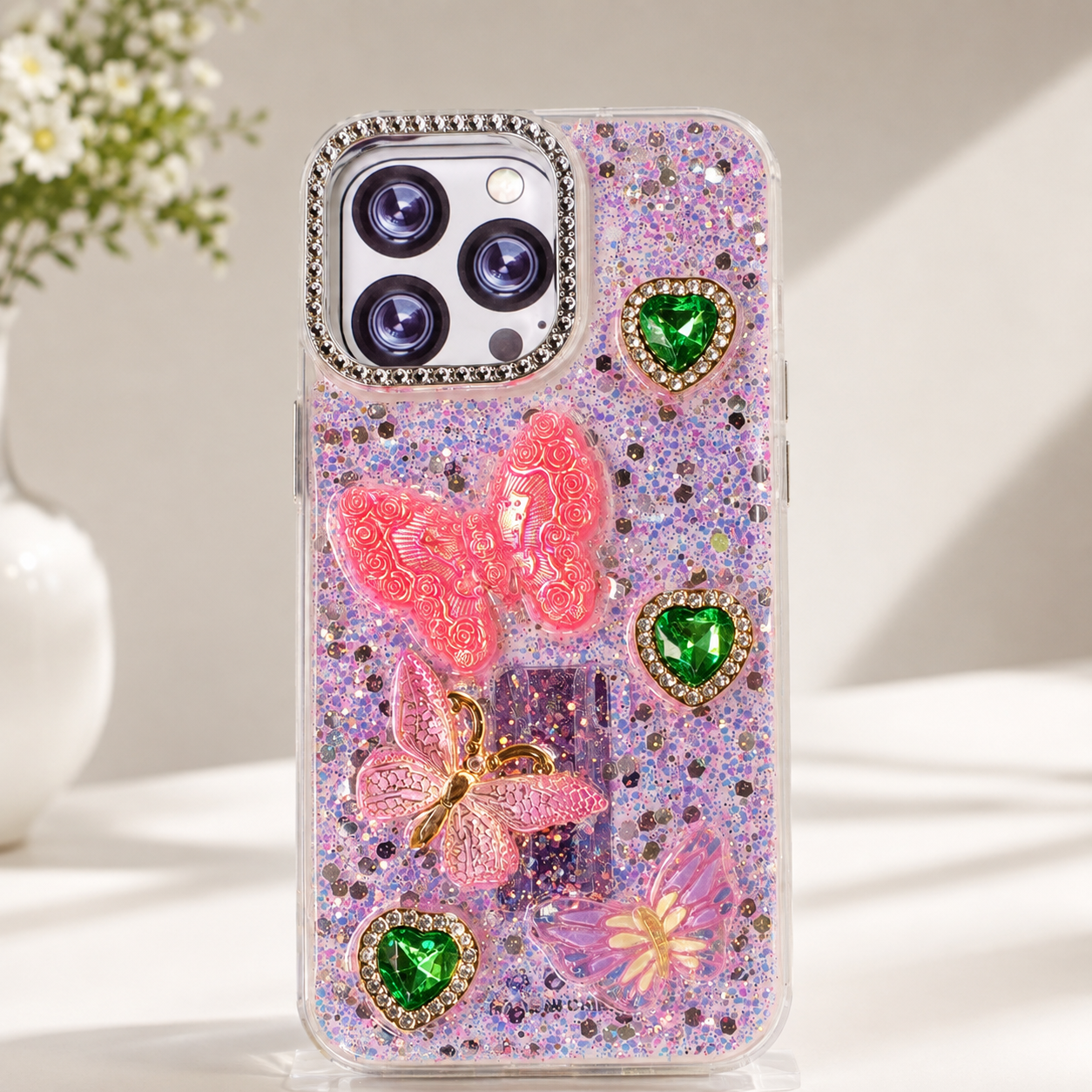 Decorative iPhone 13 Pro case with multicolour glitter, floral and heart accents
