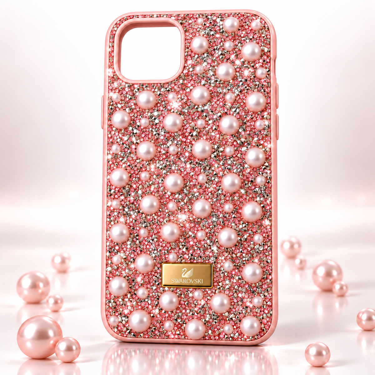 mobile case for iphone 13 and 14 embellished with diamond style rhinestones and pearls standing or placed between some pearls on clean white and pink soft subtle background giving a minimal and premium look