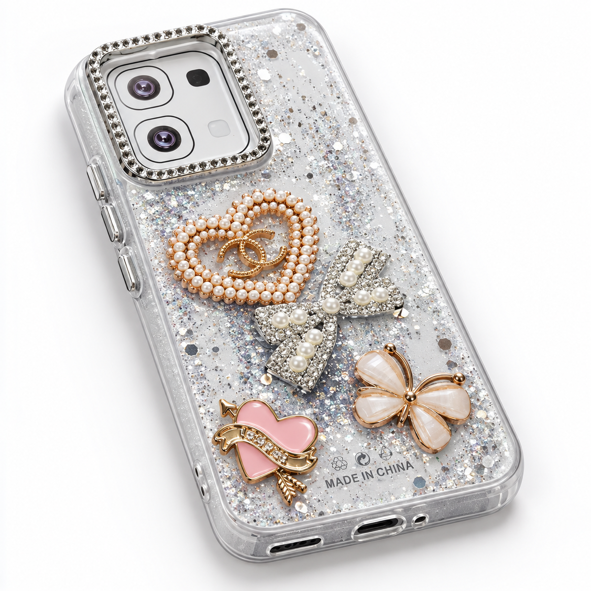 Grey clear OPPO A6 glitter case with pearl heart bow and butterfly decorations, angled studio view