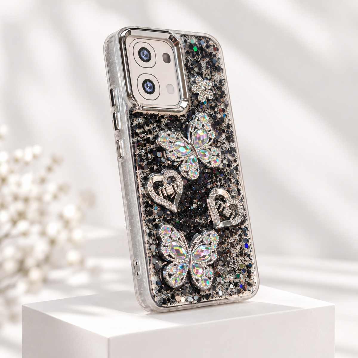 OPPO A6 Pro black glitter butterfly cover with silver heart ornaments and clear TPU sides