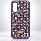 Rhinestone and pearl fashion case for Samsung Galaxy A17/A26 shown in a styled product photo