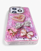 Pink glitter phone case angled view showing soft TPU sides and bottom cut-outs