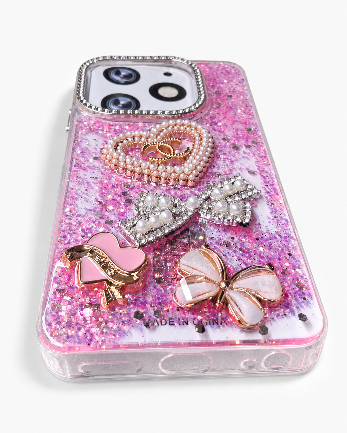 Pink glitter phone case angled view showing soft TPU sides and bottom cut-outs