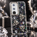 Vivo Y21d black glitter back cover with three rhinestone-style bow charms and faceted stone accents, lifestyle view