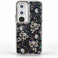 Vivo Y21d black glitter back cover with rhinestone-style bow charms and clear faceted stone accents, rear studio view